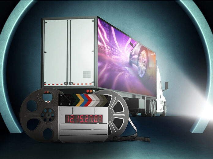 Movie Studio Projects Movie Trailer Onto Moving Movie Trailer